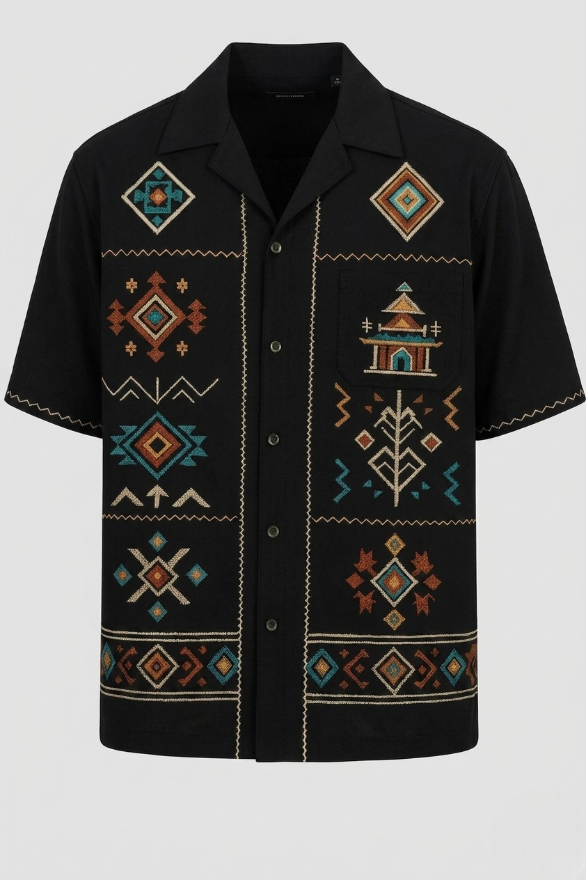 Black shirt with geometric and tribal patterns on a white background