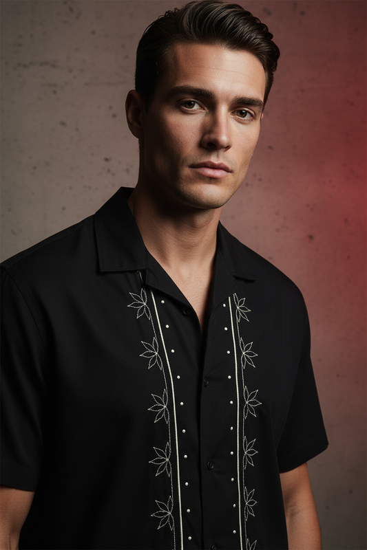 Black short-sleeve shirt with white embroidery on a light gray background