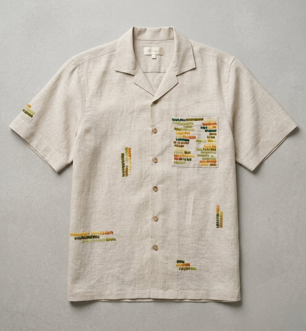 Beige short-sleeve shirt with text patterns on a gray background